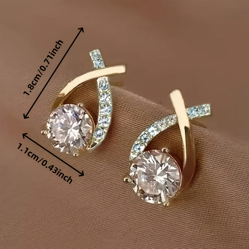 Stud earrings with gold cross and zirconia stones