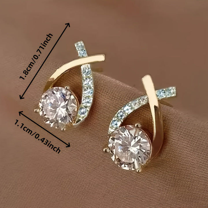 Stud earrings with gold cross and zirconia stones
