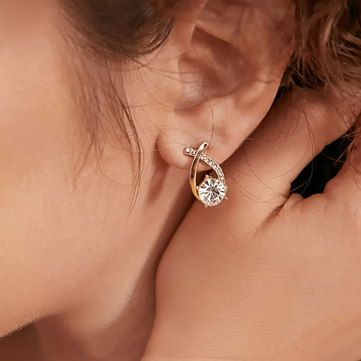 Stud earrings with gold cross and zirconia stones