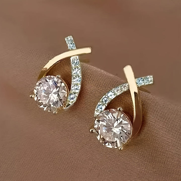 Stud earrings with gold cross and zirconia stones